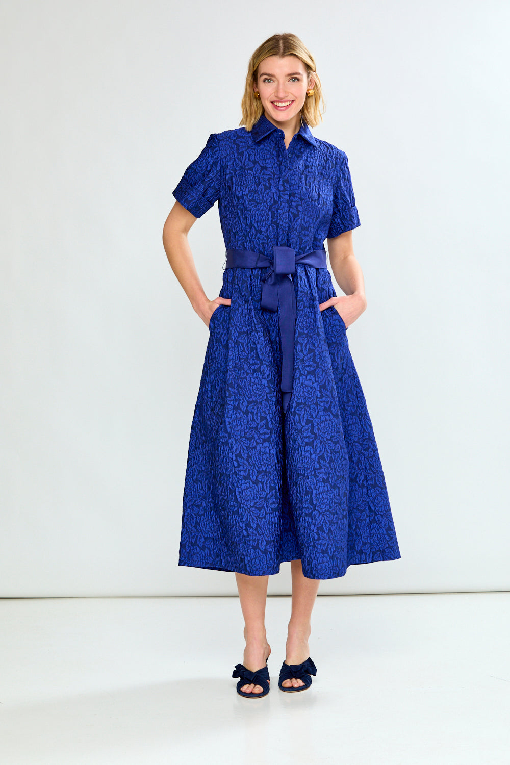 Woman in blue dress with bow