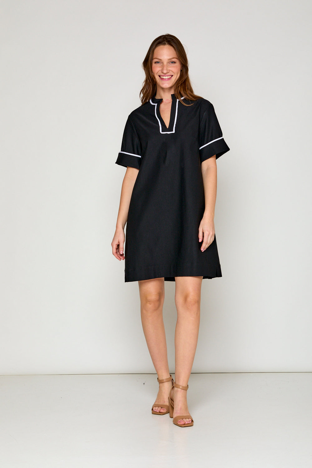 Woman in black short sleeve dress