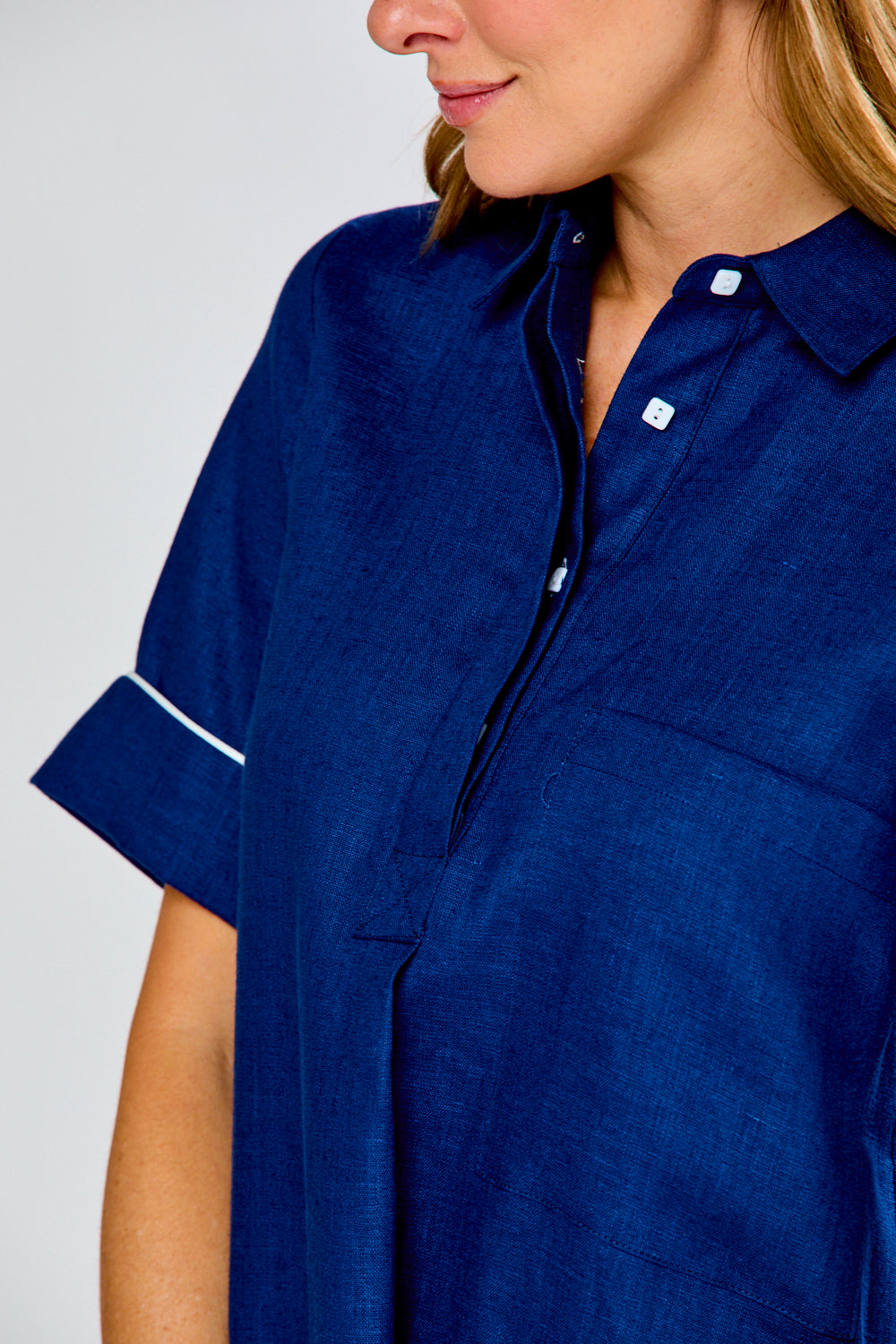 Woman in navy linen dress