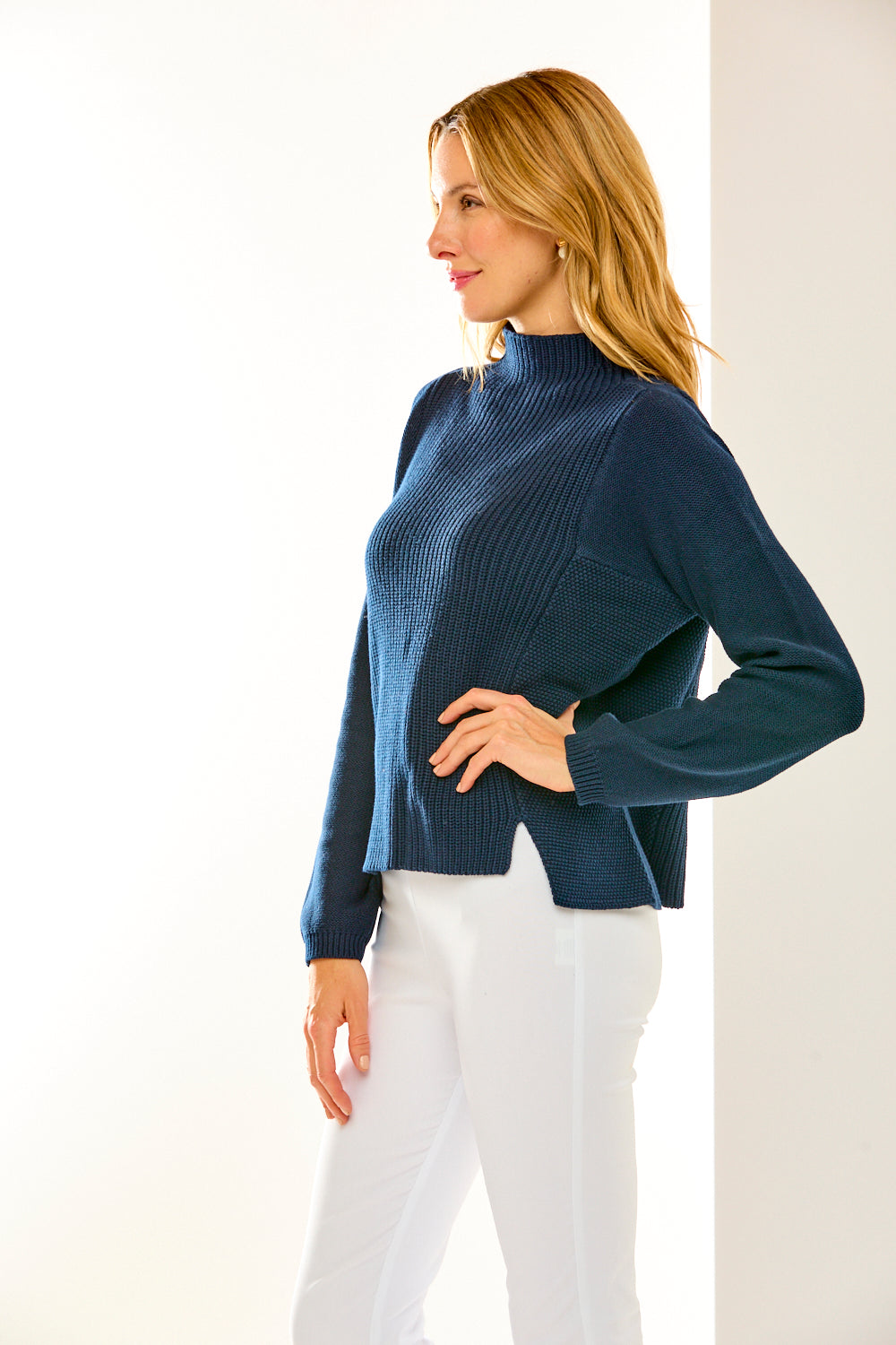 Woman in mock neck sweater