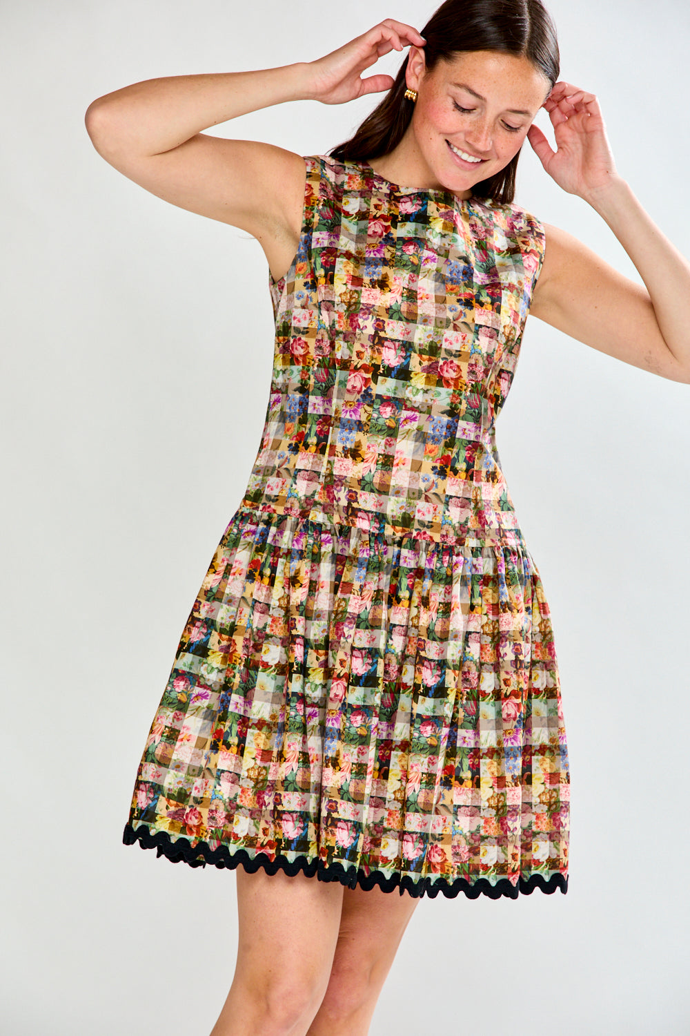 Woman in floral gingham dress
