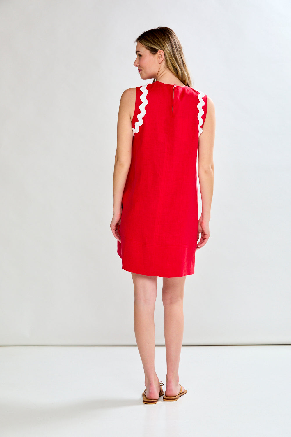 women in red dress with ric-rac