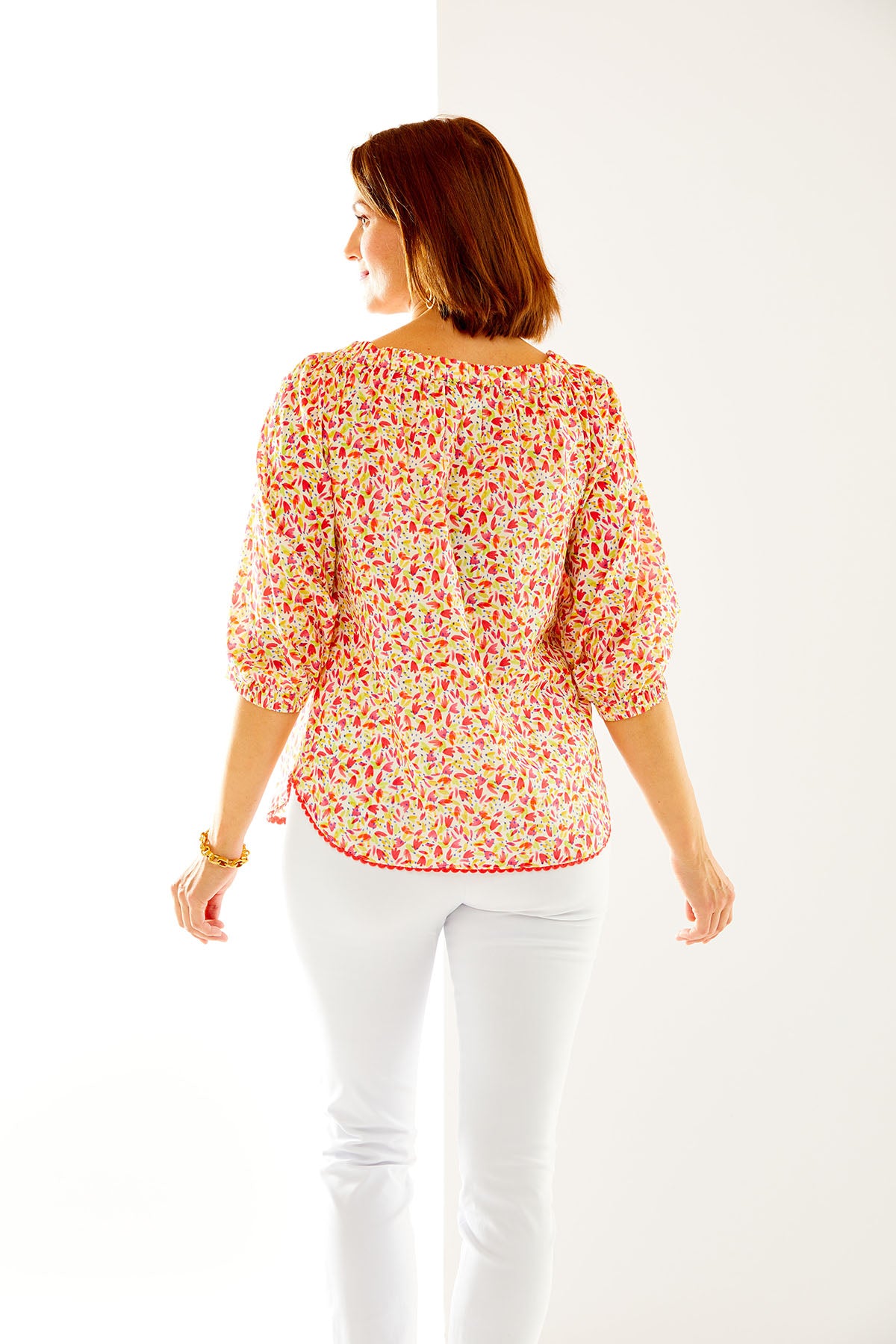 Woman in peasant sleeve blouse