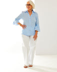 Woman in light blue button down blouse