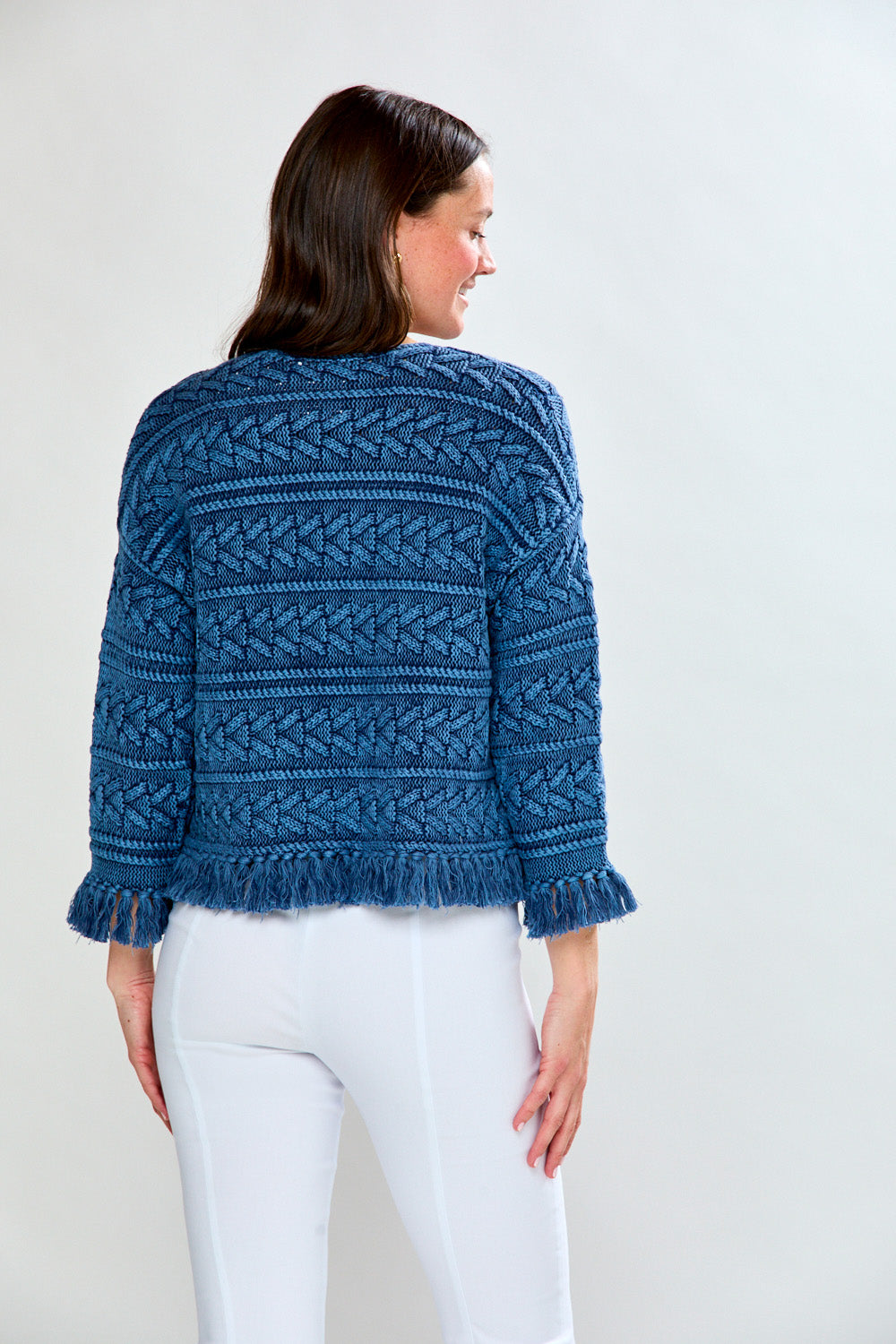 Woman in denim fringe cardi
