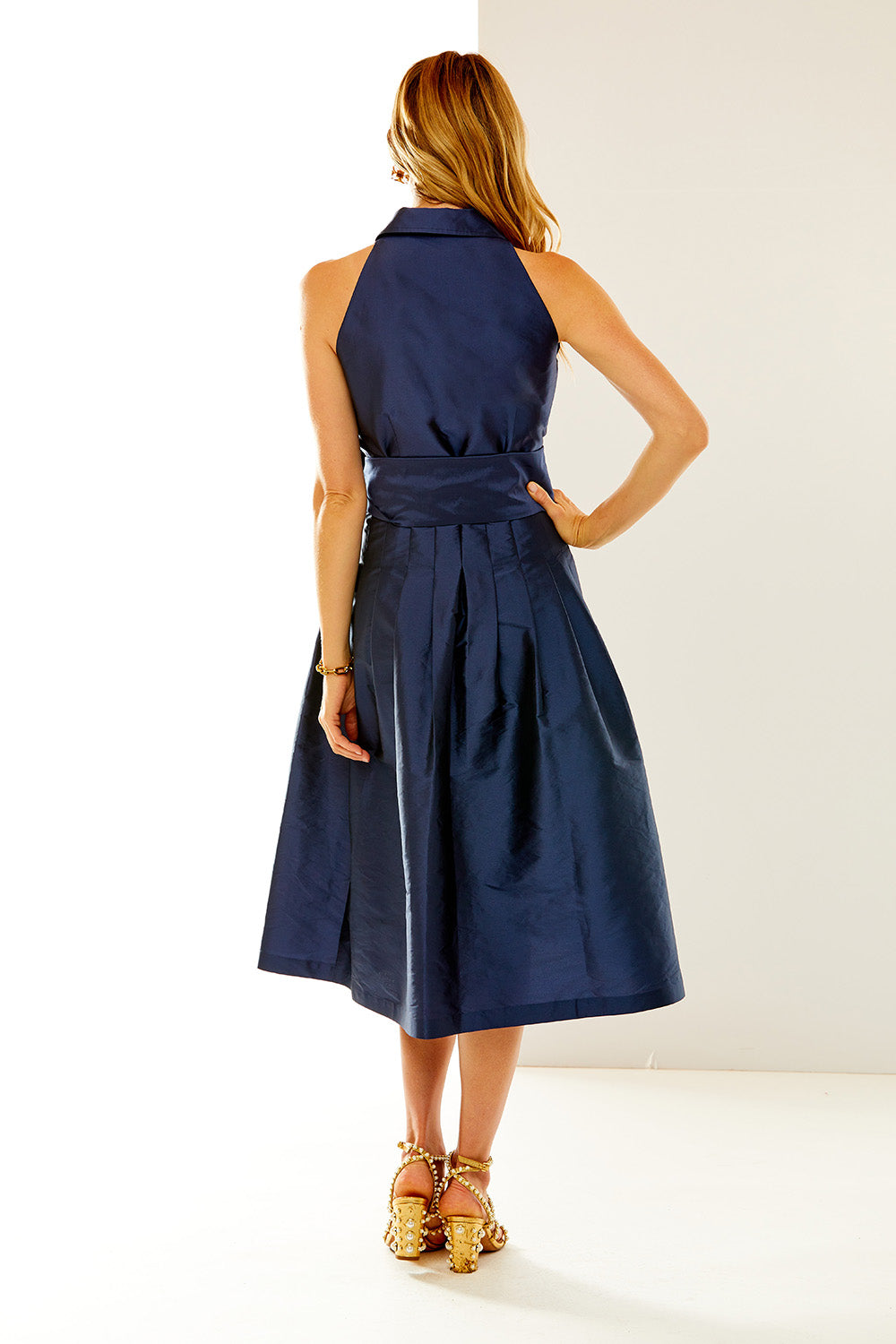 Woman in navy taffeta dress