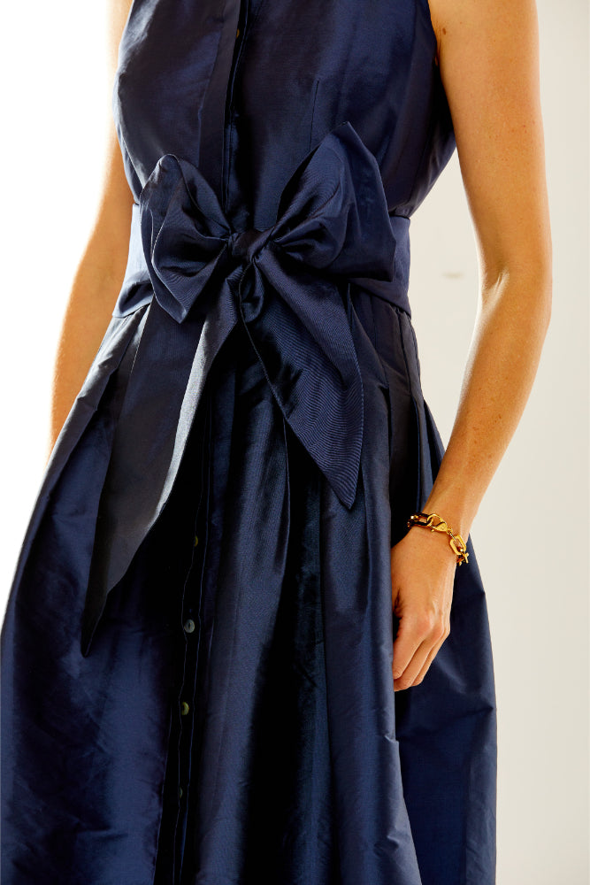 Woman in navy taffeta dress