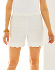 Woman in white scallop short