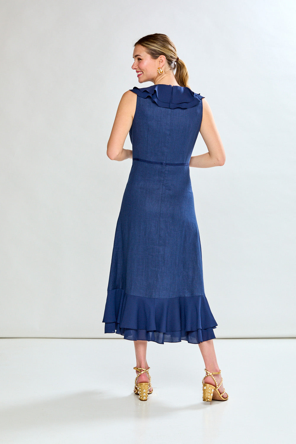 Woman in navy tea length dress