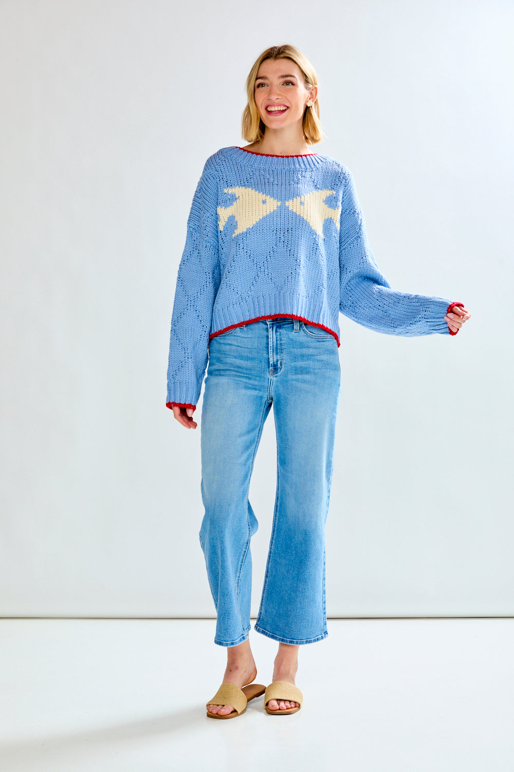 Woman with blue fish sweater on