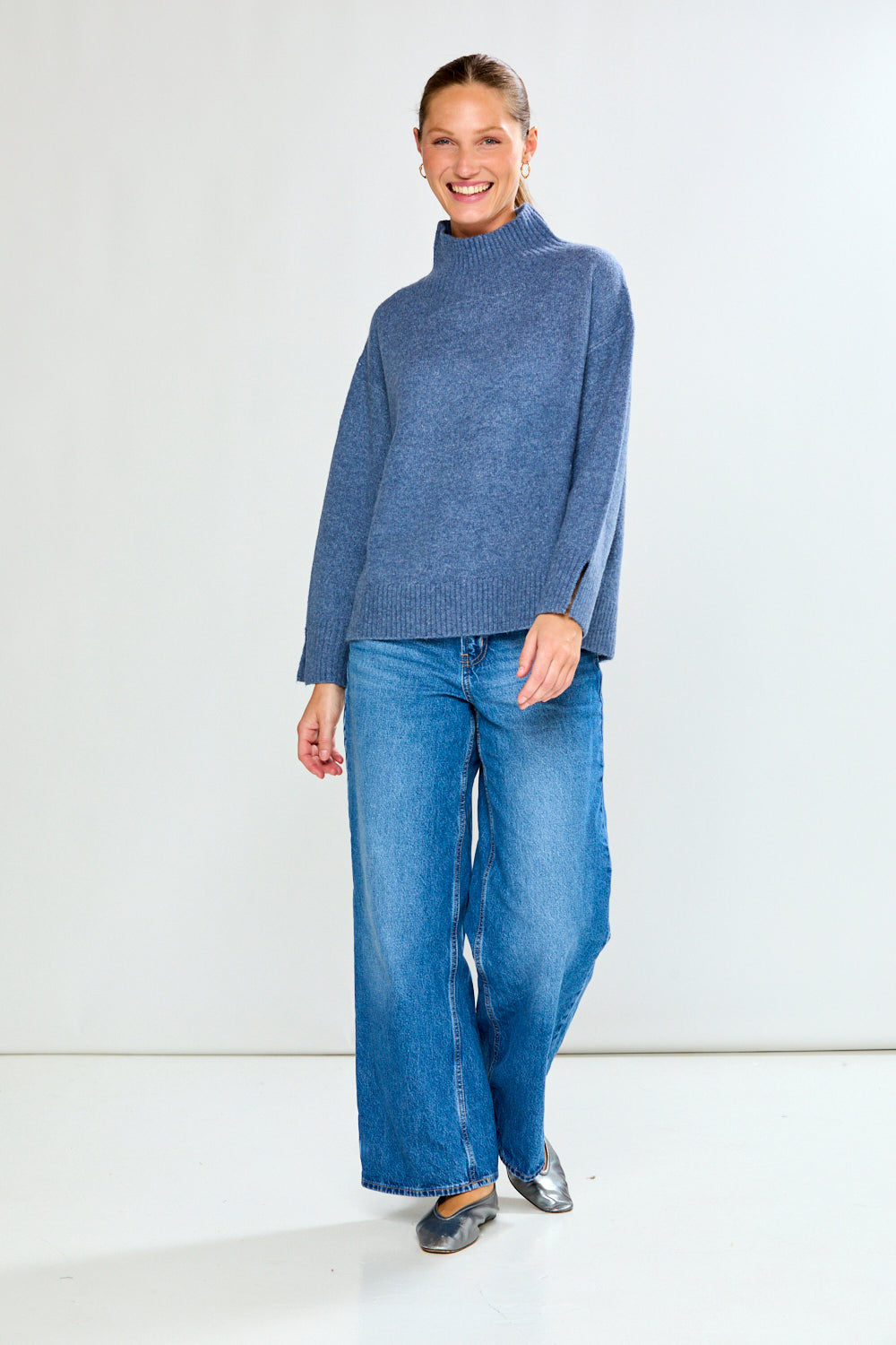 Woman in denim sweater with jeans