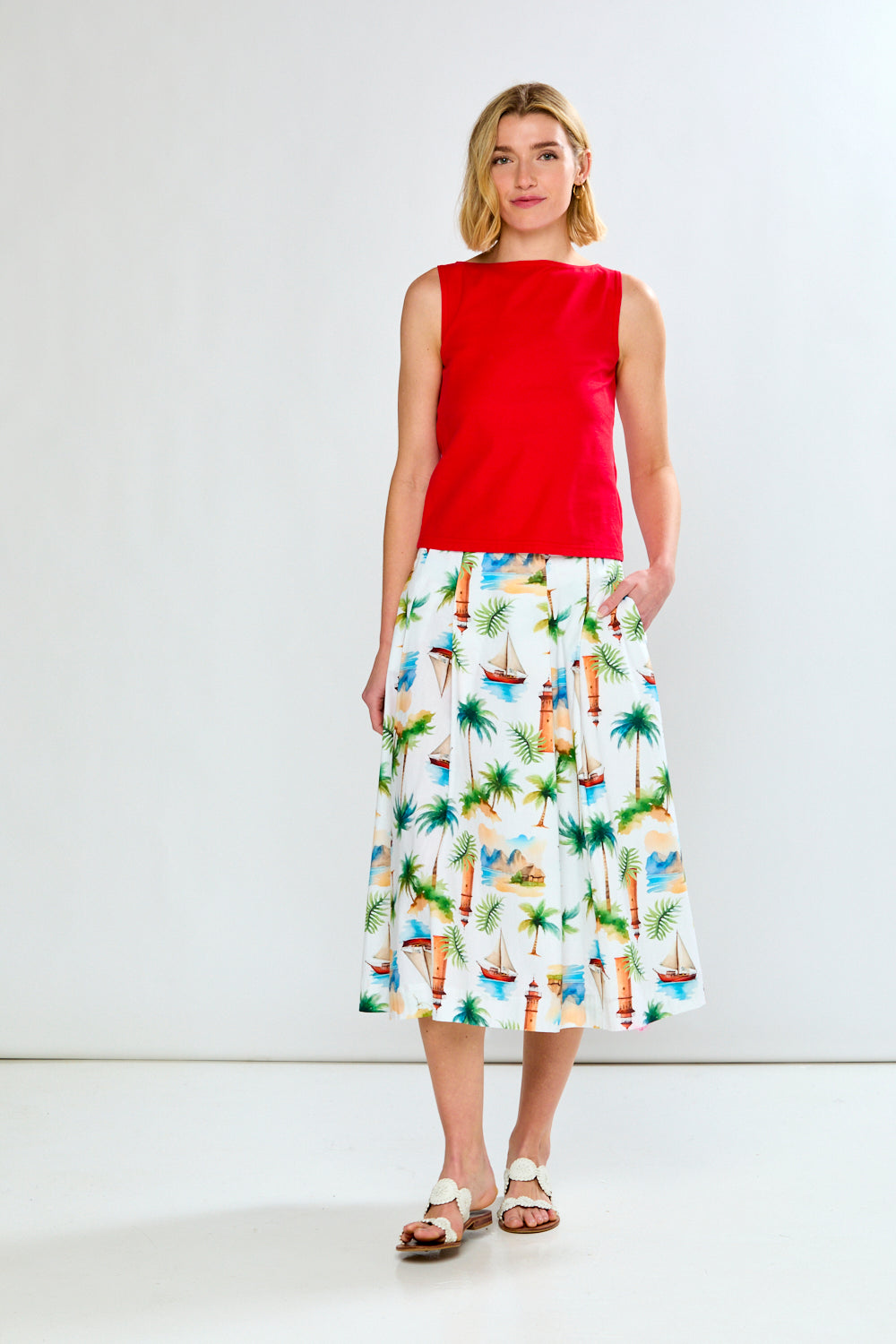 Woman in solid top and printed skirt