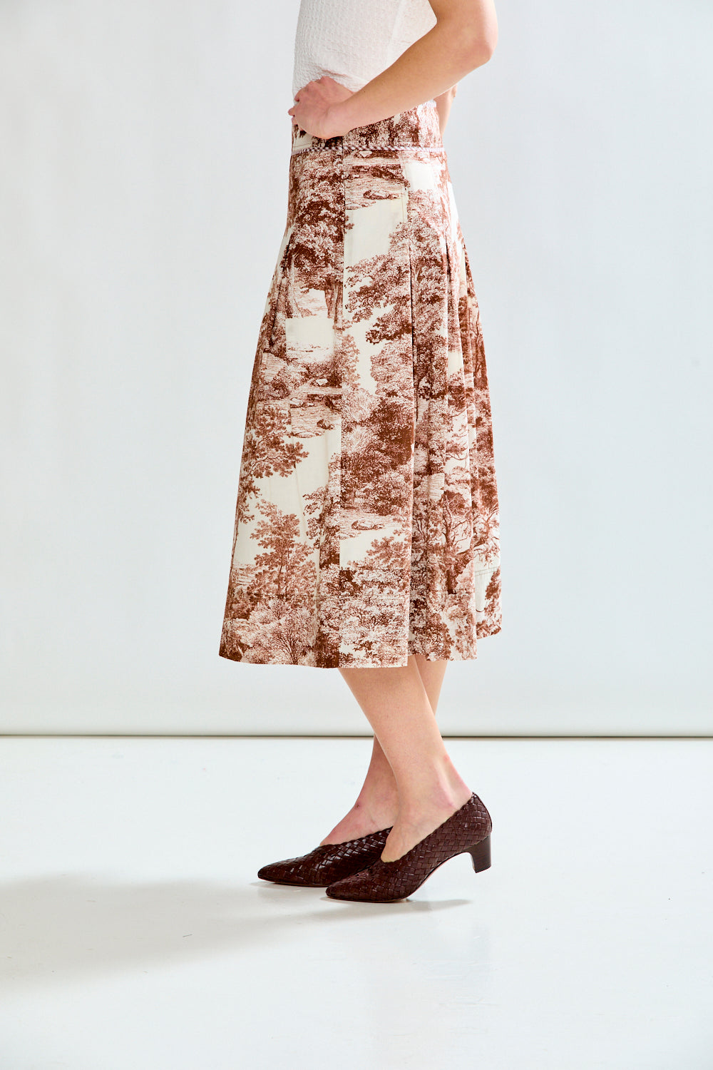 Woman in toile print skirt