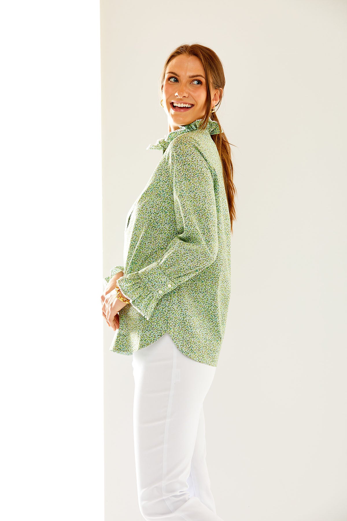 Woman in long sleeve green blouse