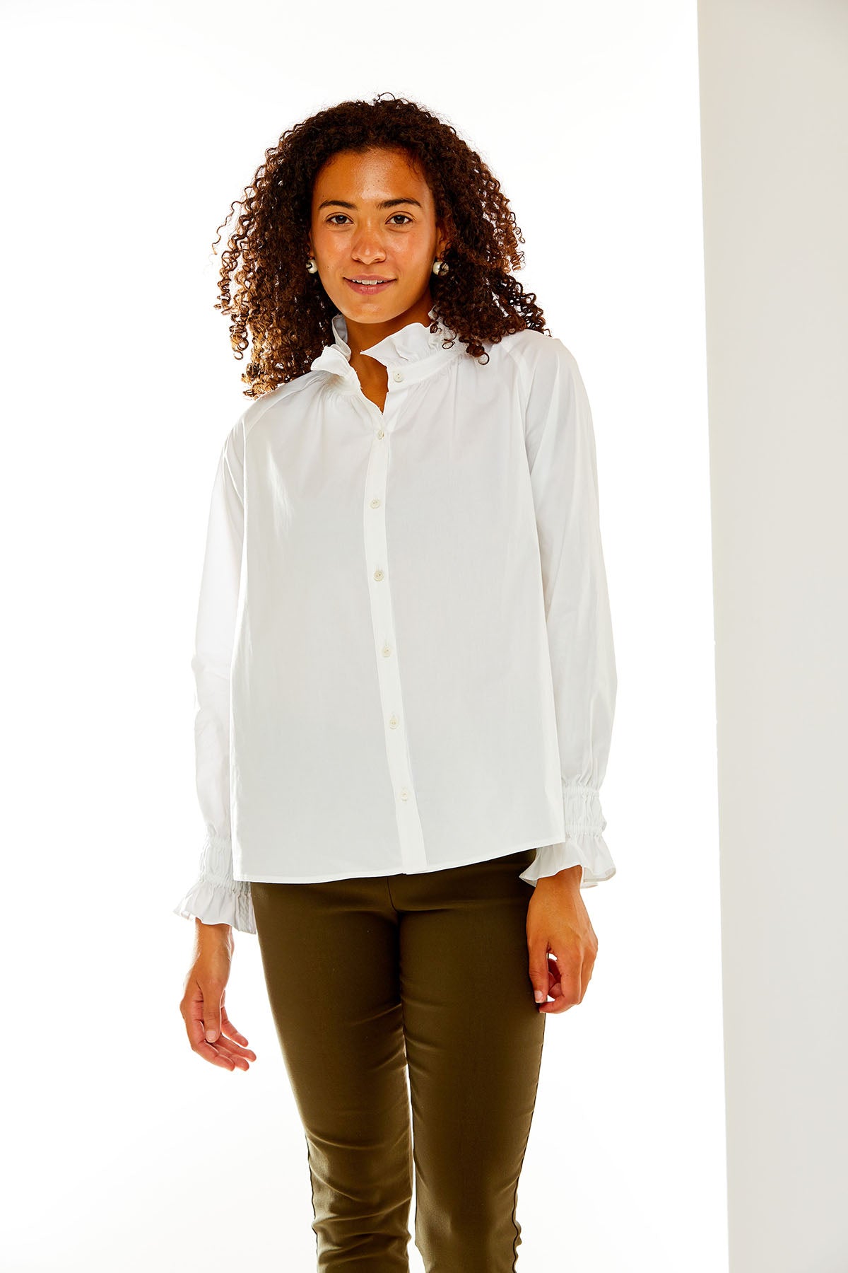 Woman in white button down shirt