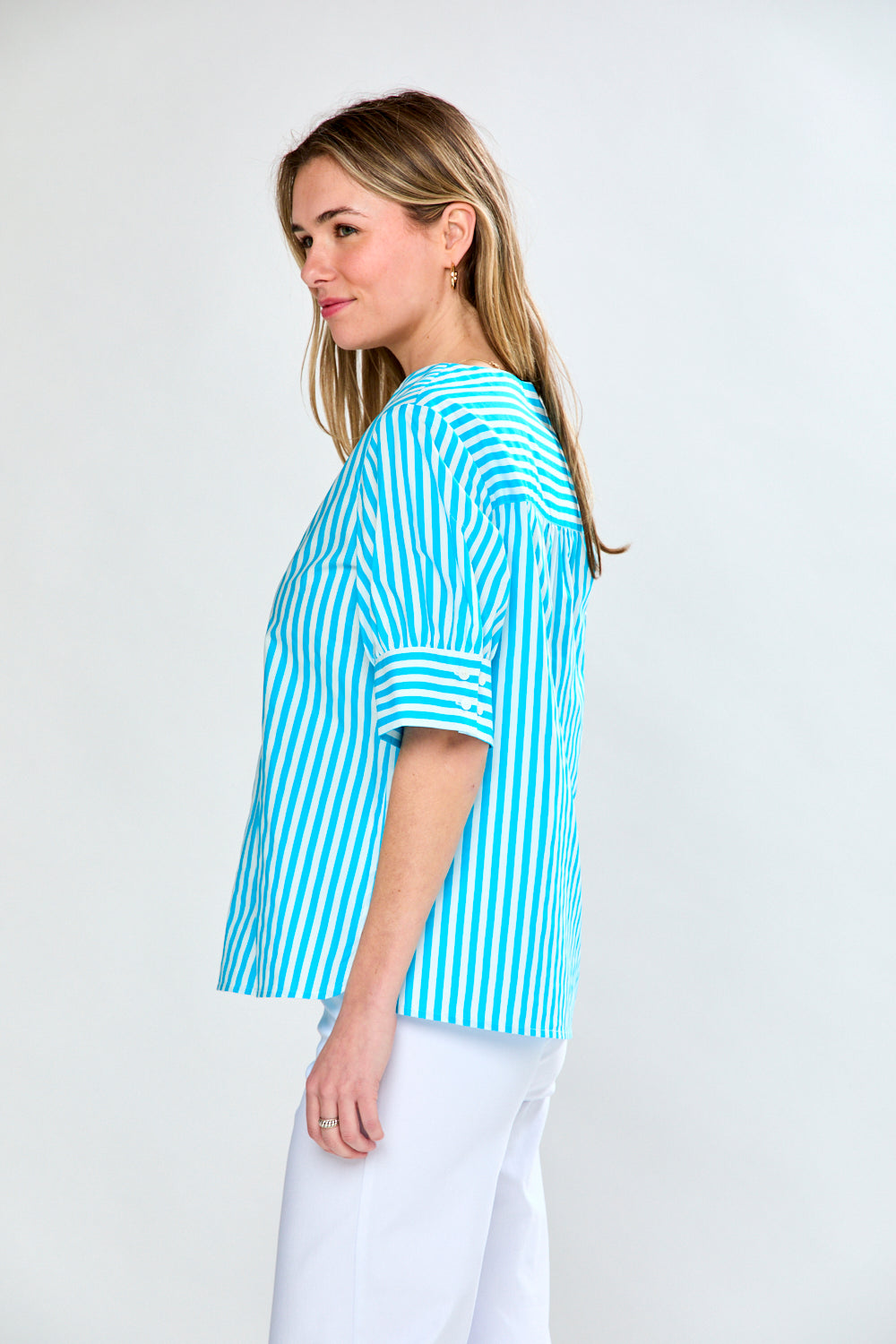 Woman in aqua stripe top