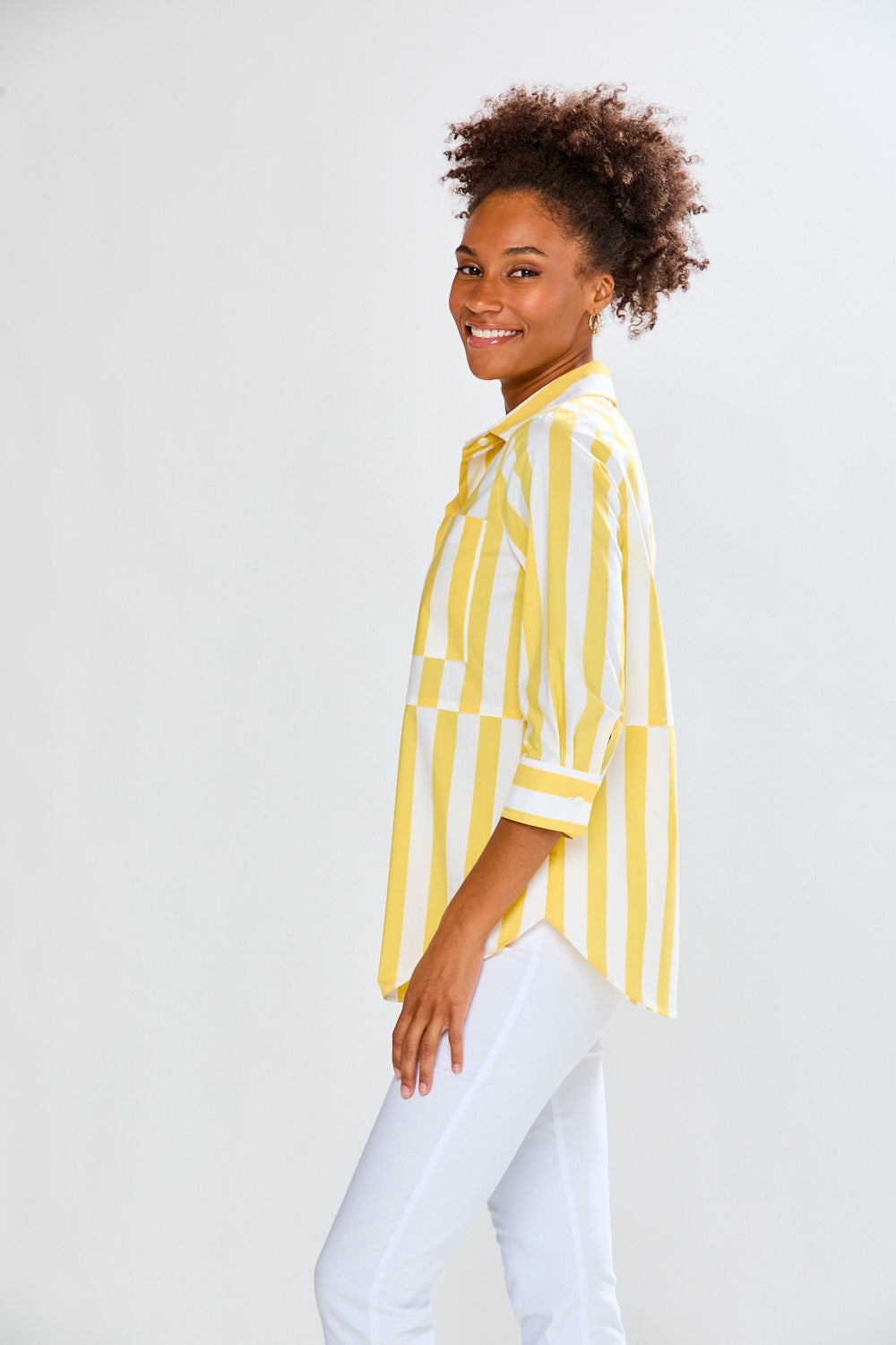 Woman in yellow and white striped top