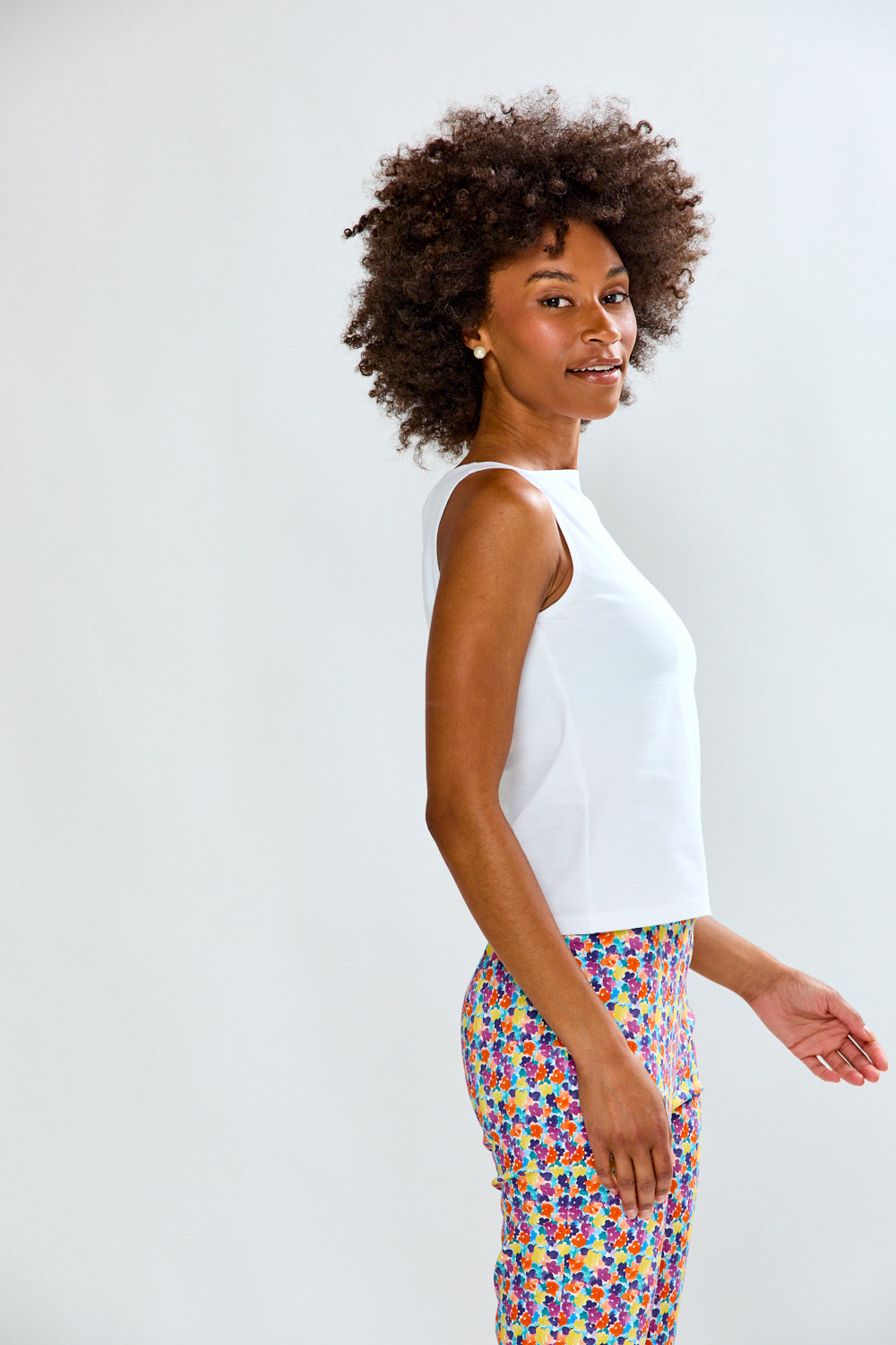 Woman in solid top and printed pants