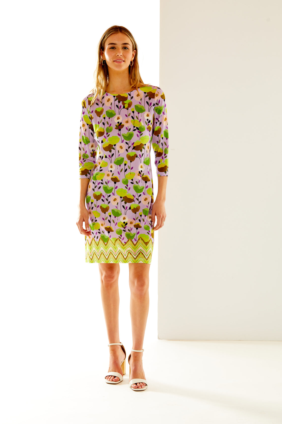 Woman in floral chevron print dress