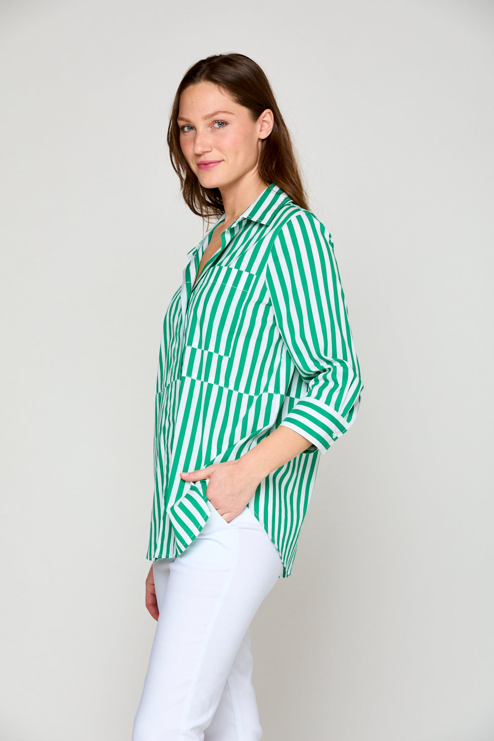 Woman in green and white stripe blouse