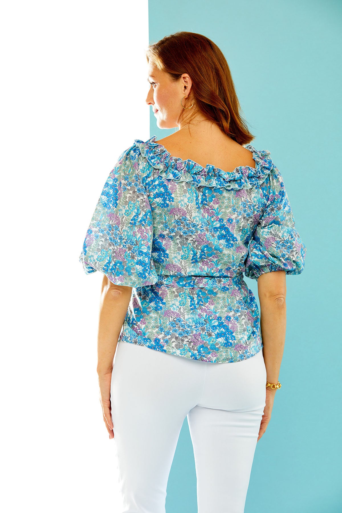 Woman in floral print blouse
