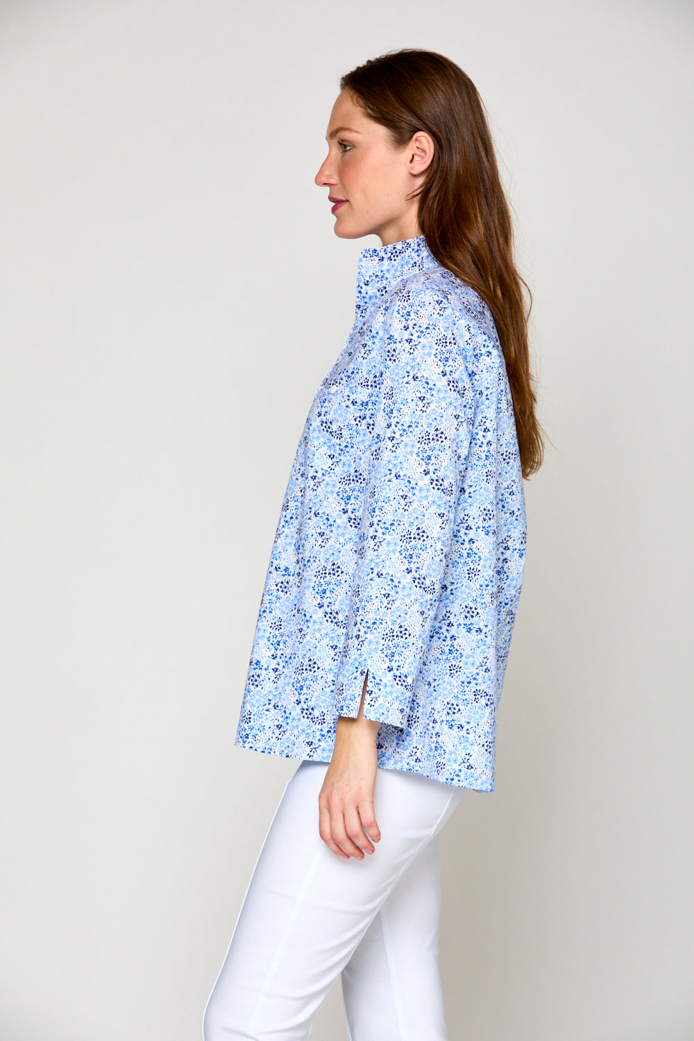 Woman in blue floral top