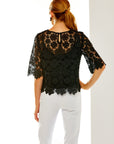 Woman in black lace top