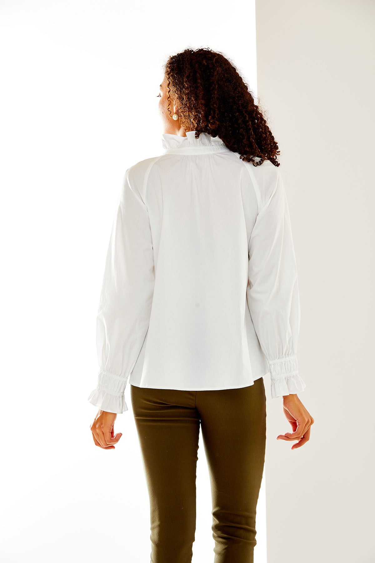 Woman in white button down shirt