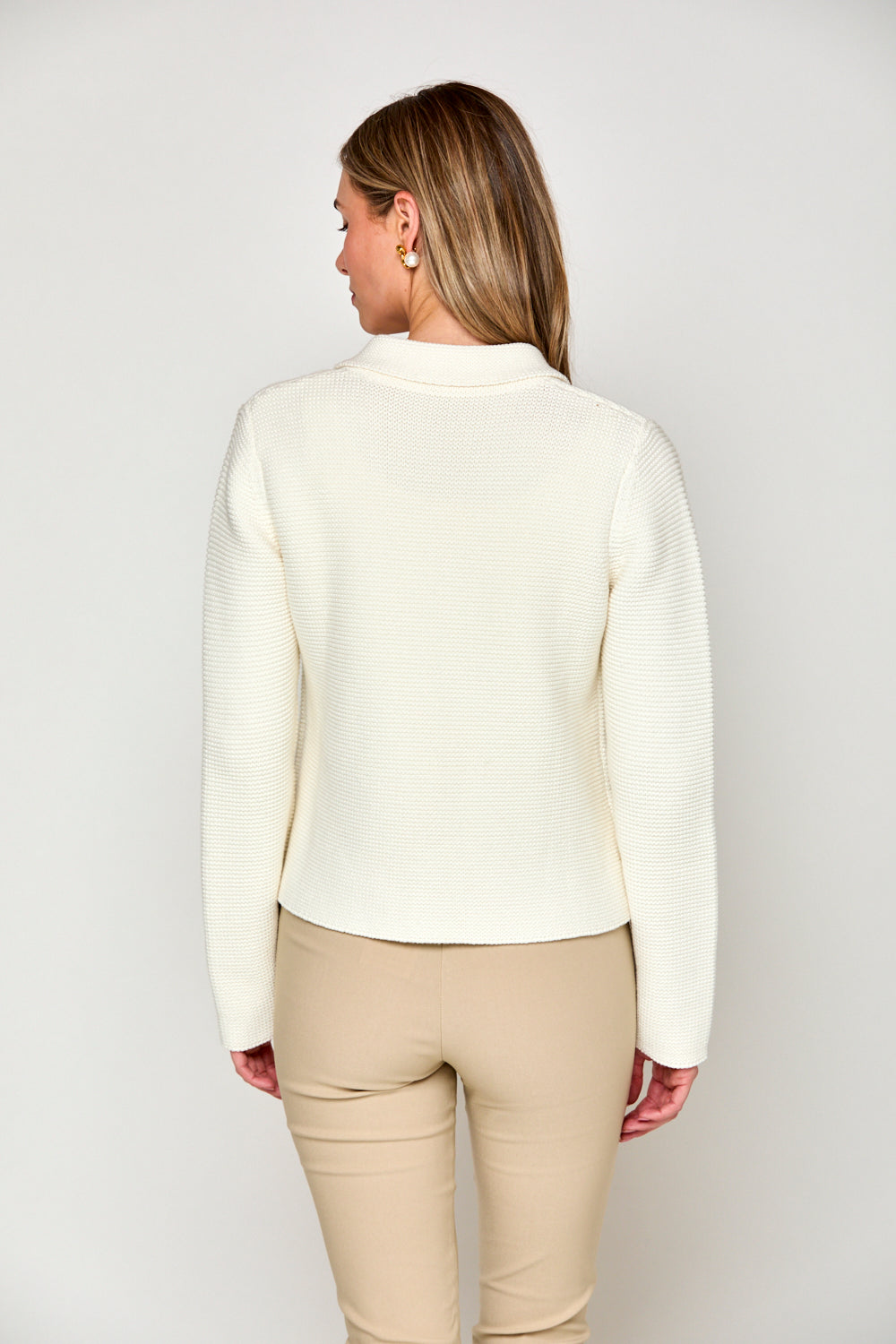 Woman in off white sweater