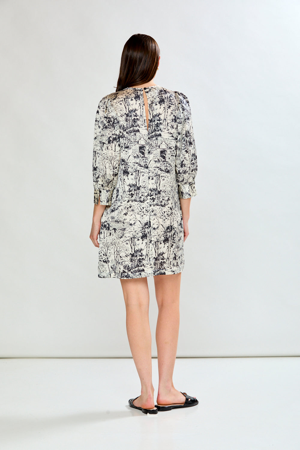Woman wearing vintage toile dress