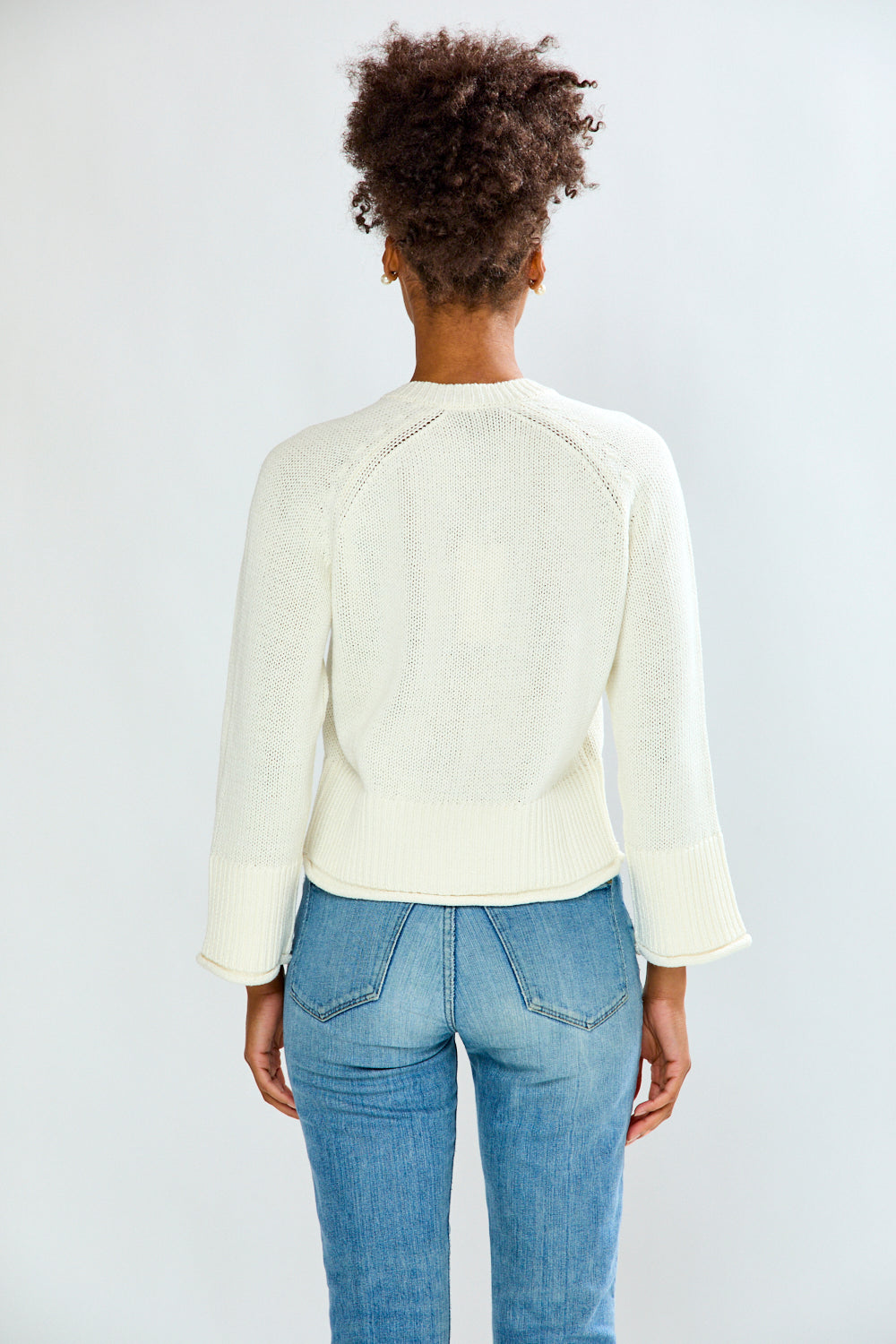 Girl in sand sweater