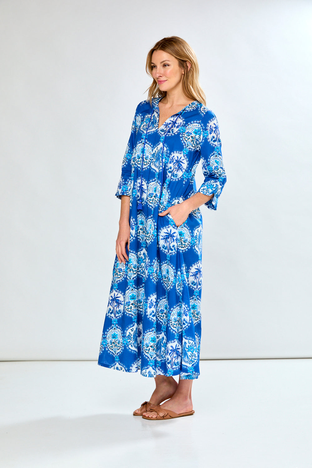 Woman in blue french tile caftan