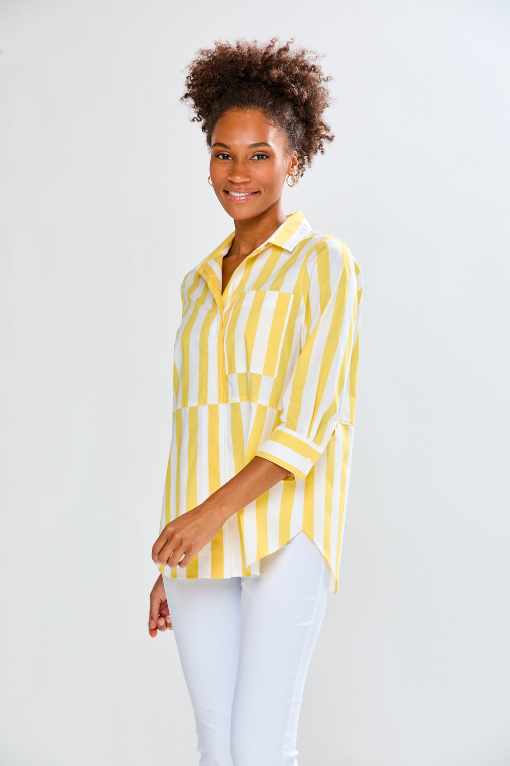 Woman in yellow and white striped top