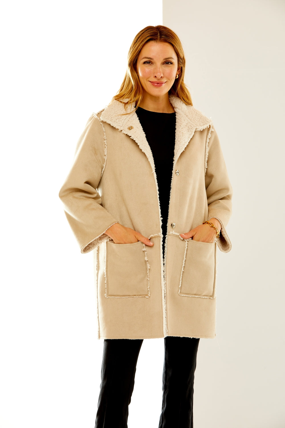 Woman in suede and shearling coat