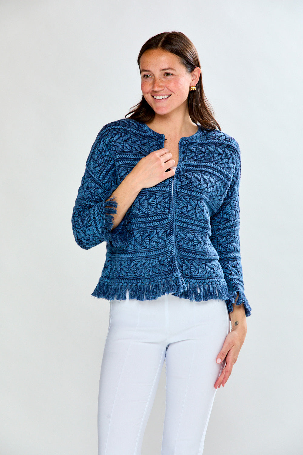 Woman in denim fringe cardi