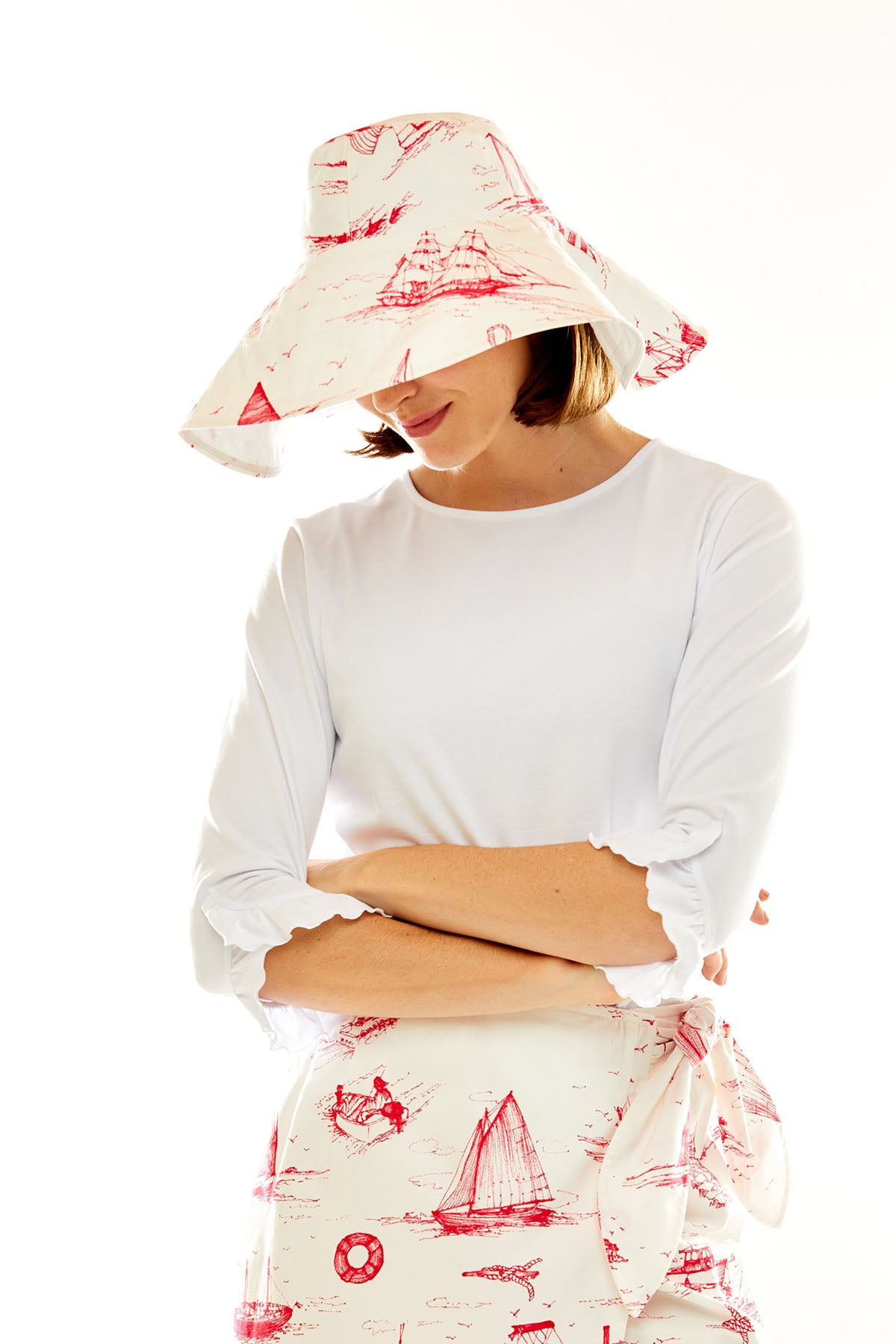 Woman in pink nautical toile hat
