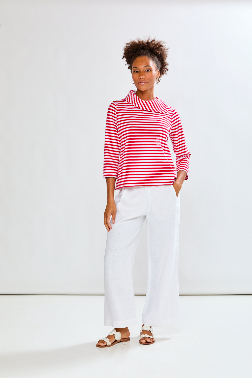 Woman in a white and red striped knit top