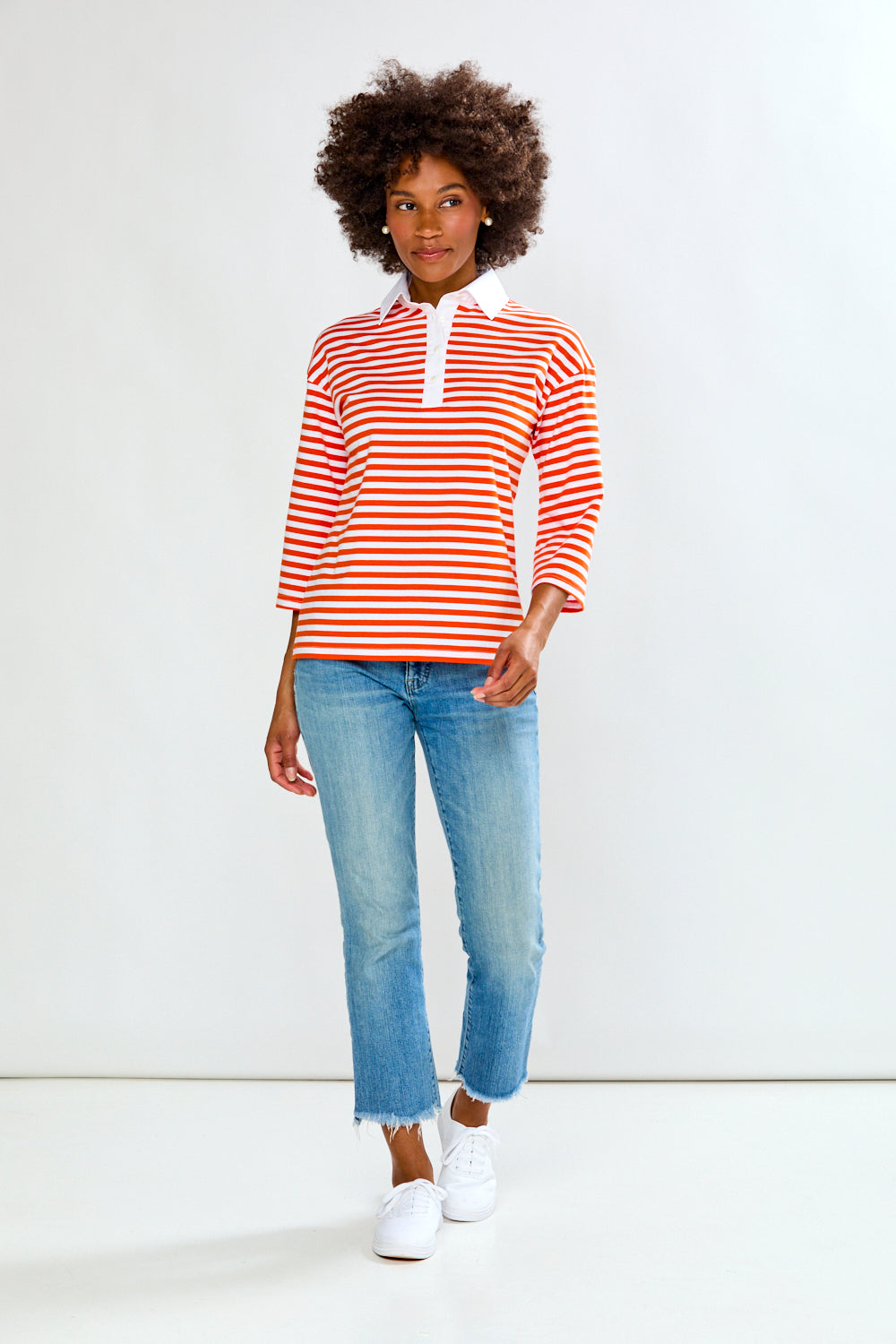 Woman in Orange & White Stripe top
