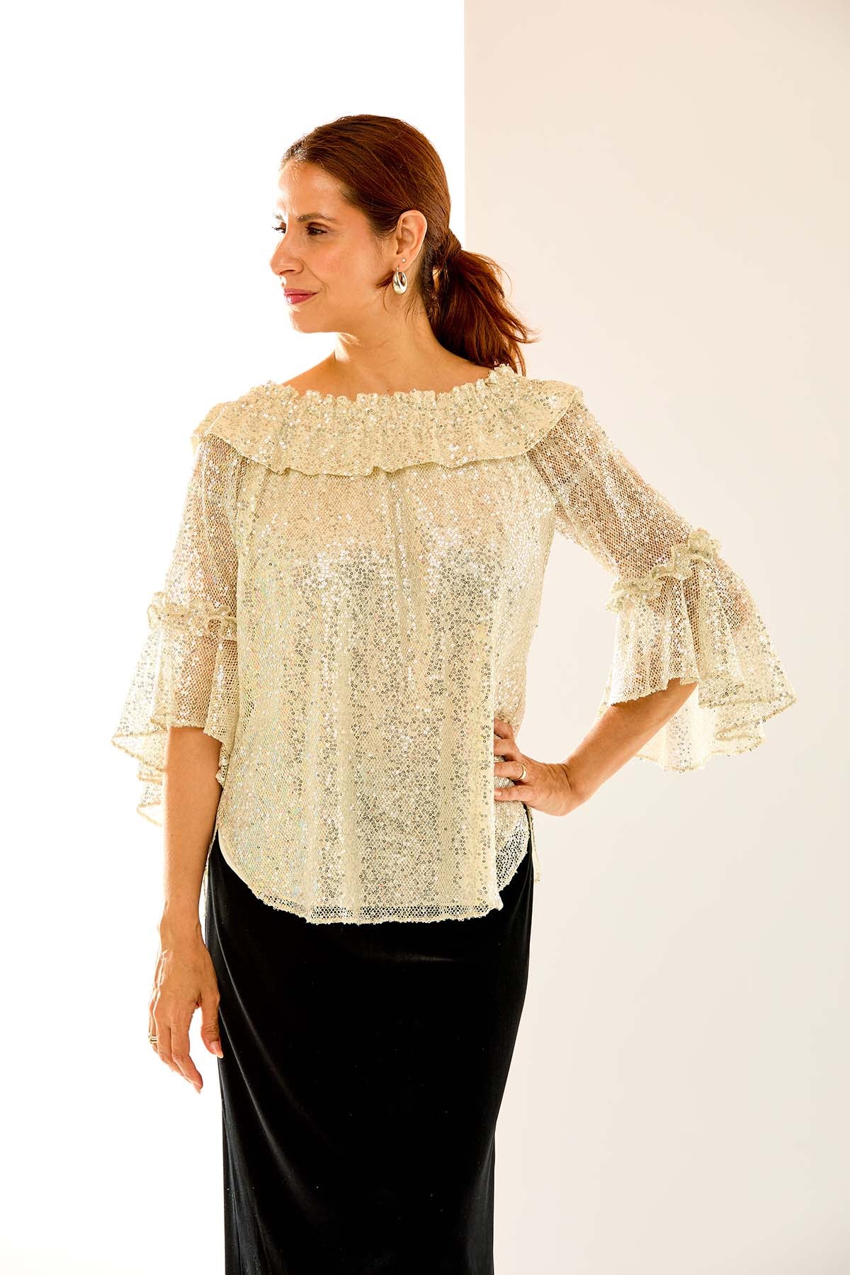 Woman in sequin mo blouse