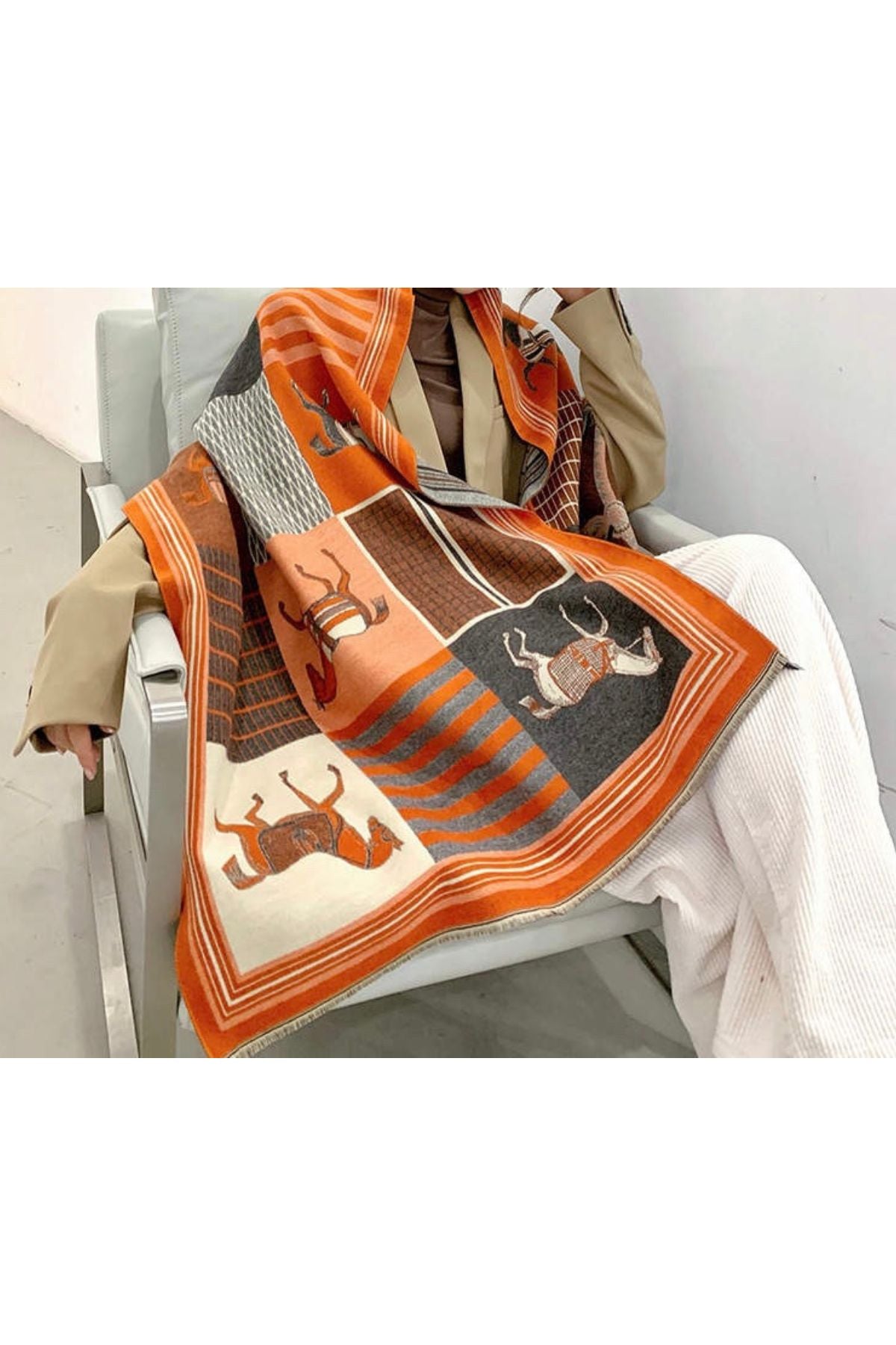 Woman in orange equestrian scarf