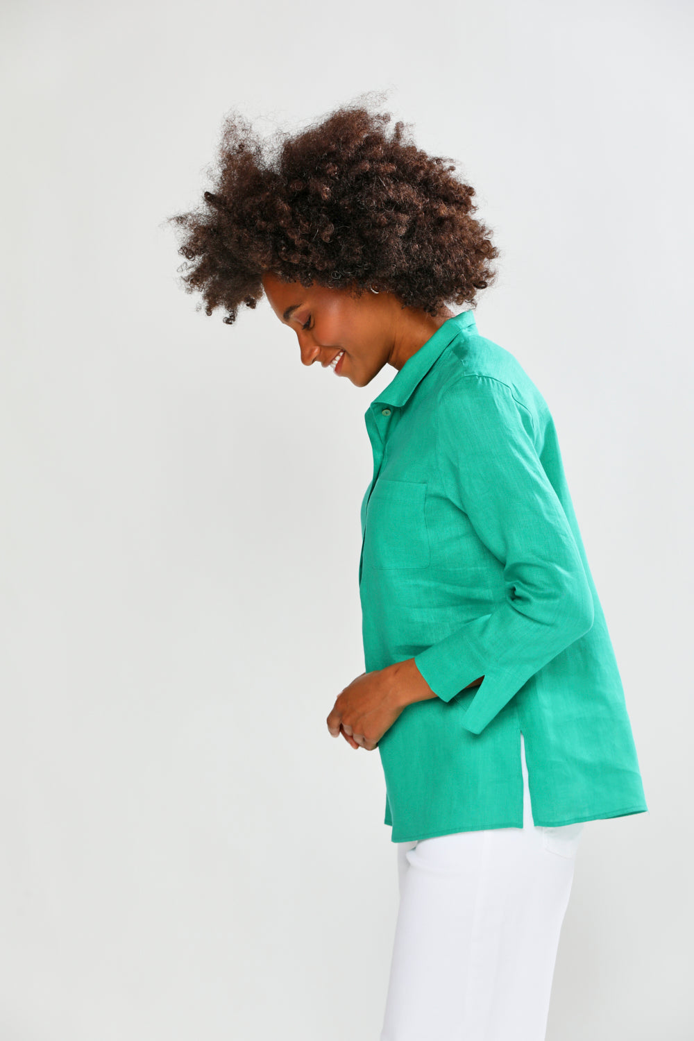 Woman wearing a green blouse on a white background