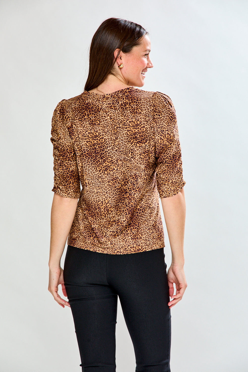 Woman in leopard print top