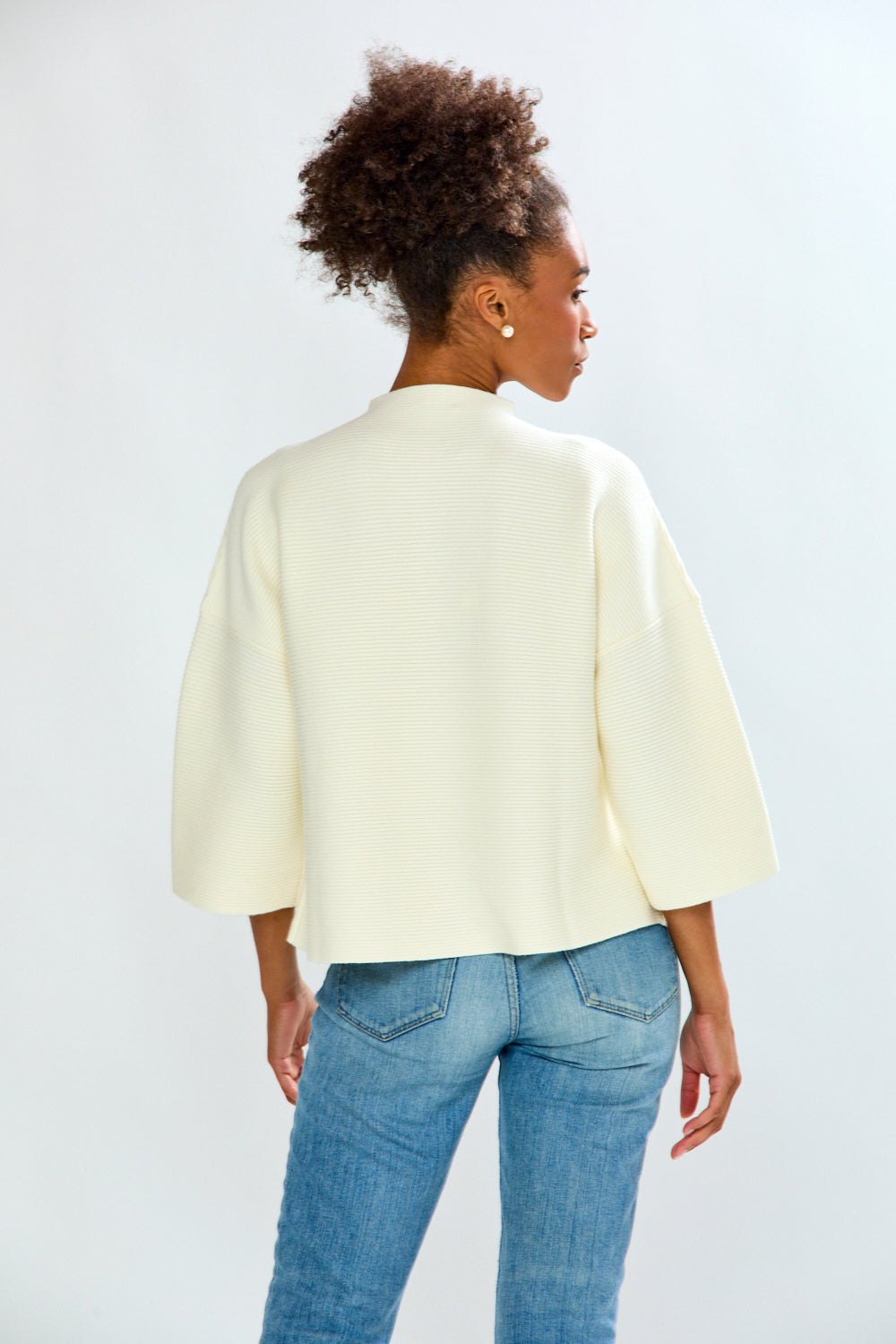 Girl is white sweater