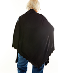 Woman in black scallop triangle wrap