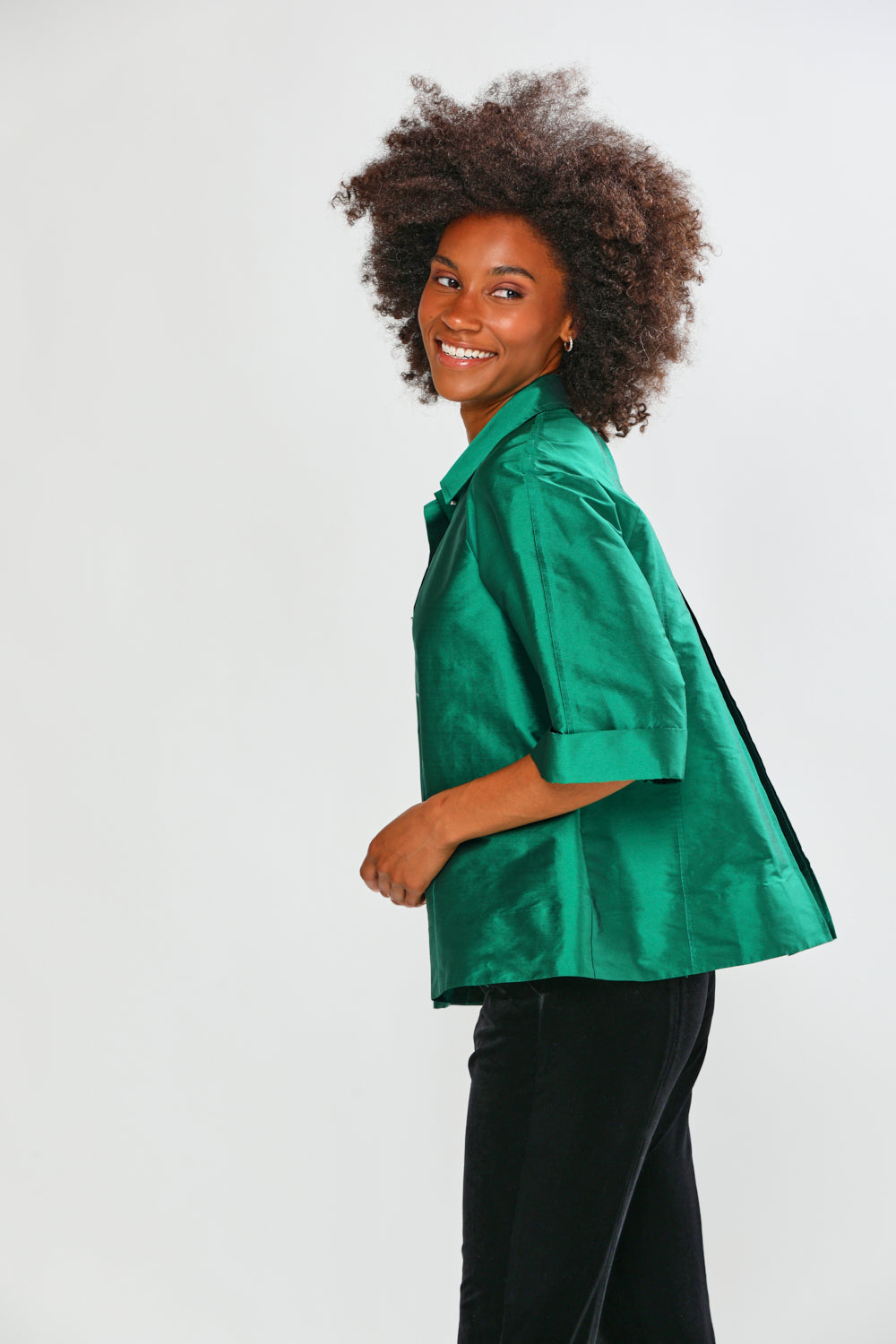 Woman wearing a green blouse on a white background