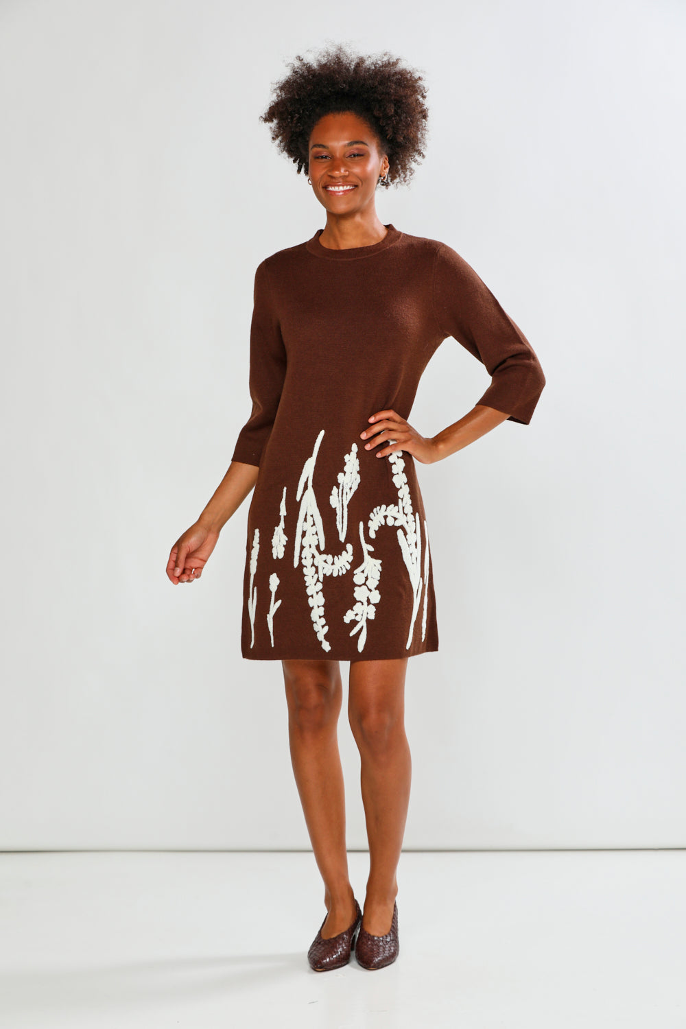 Woman in espresso print dress