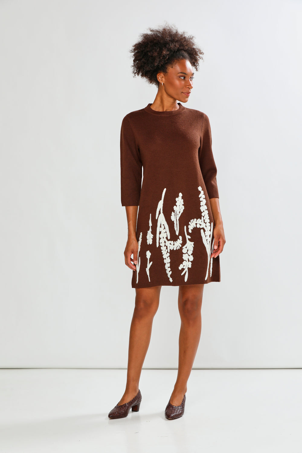 Woman in espresso print dress