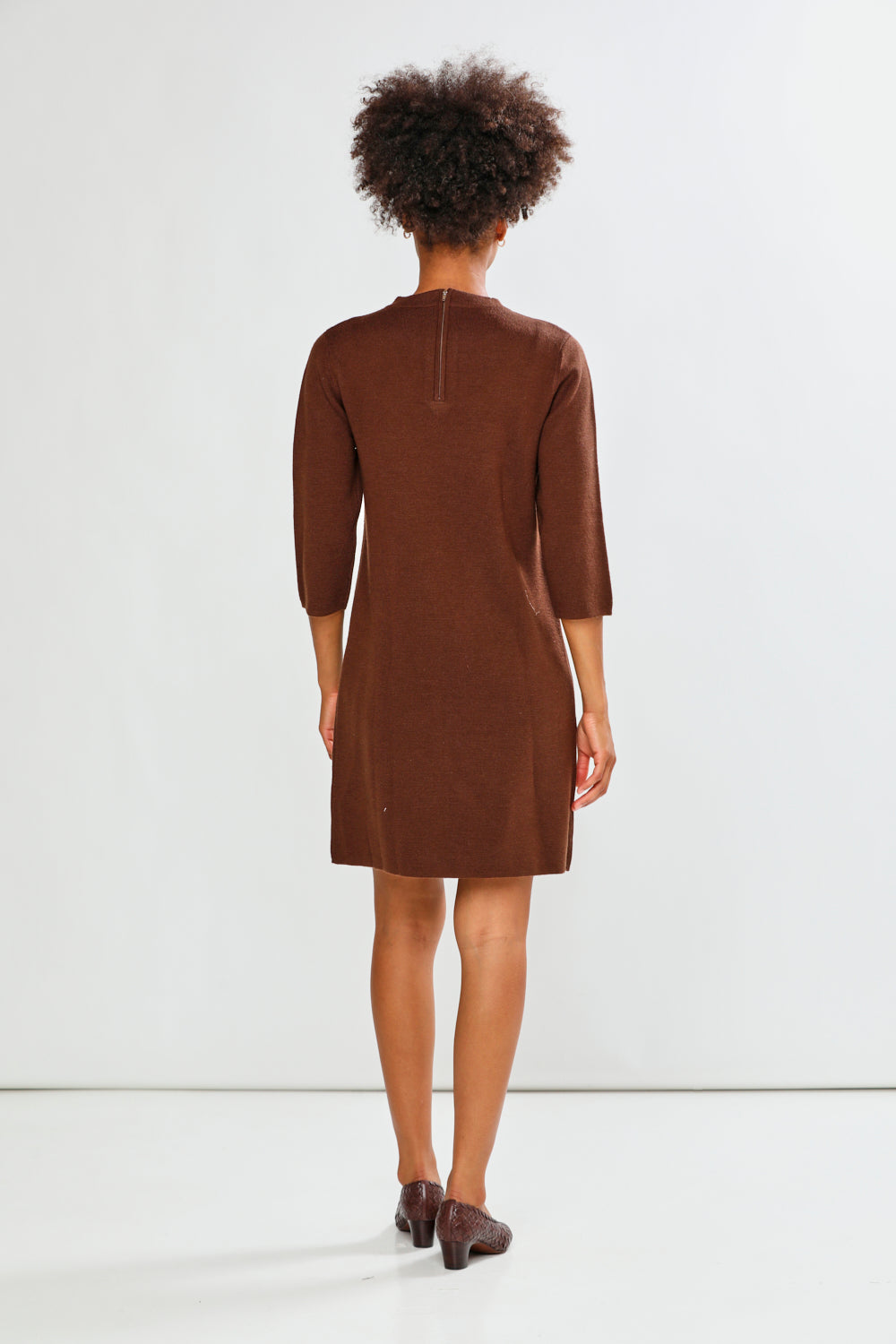 Woman in espresso print dress