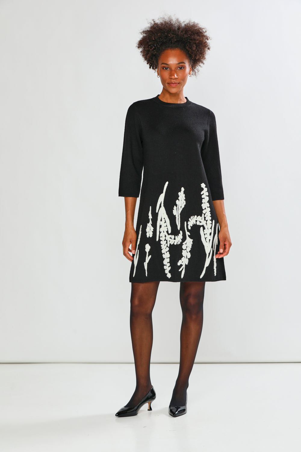 Woman in black printed dress