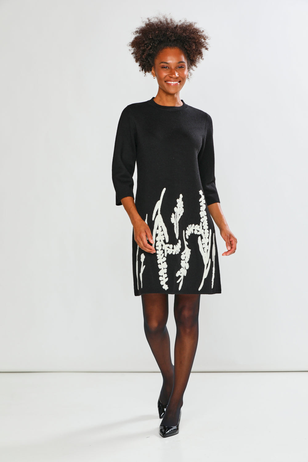 Woman in black printed dress